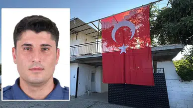 Şehit polis memurunun babaevine Türk bayrağı asıldı